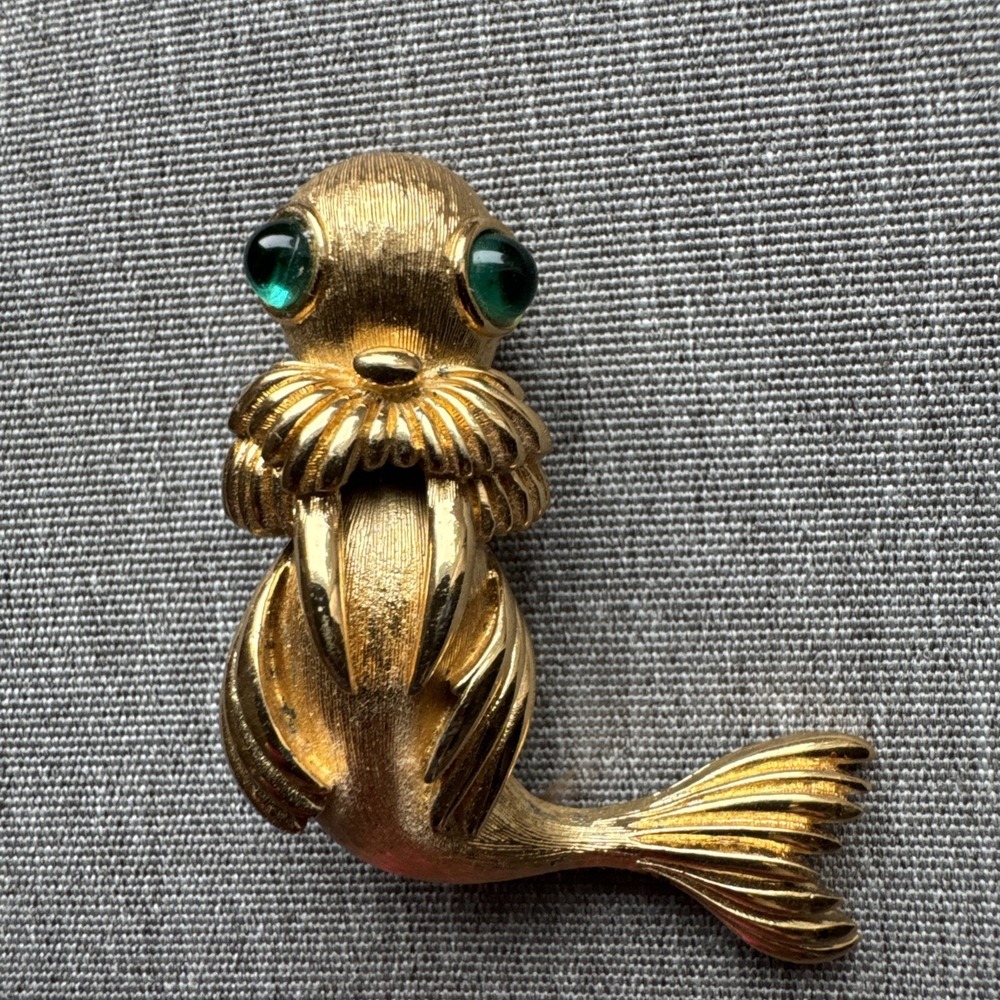 Vintage Monet Sea Lion Figural Brooch Gold Tone Green rhinestone Cabochon Eyes